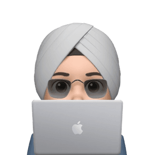 Person peeking from behind laptop